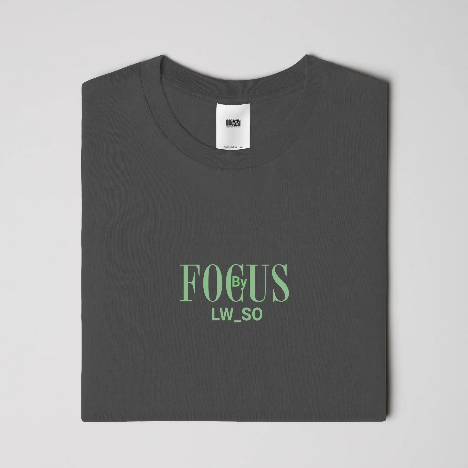 Folded charcoal Focus by LWSO Epic T-Shirt with green text logo on chest in modern fit design
