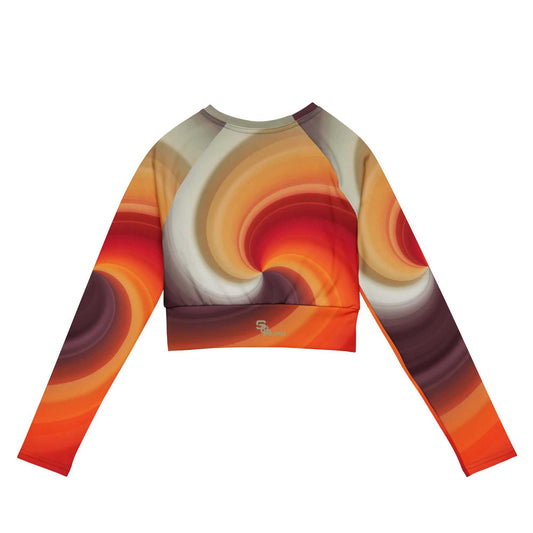 SOAura long-sleeve crop top with vibrant swirl pattern, made of recycled polyester and elastane, featuring raglan sleeves and wide double-layered waistline band
