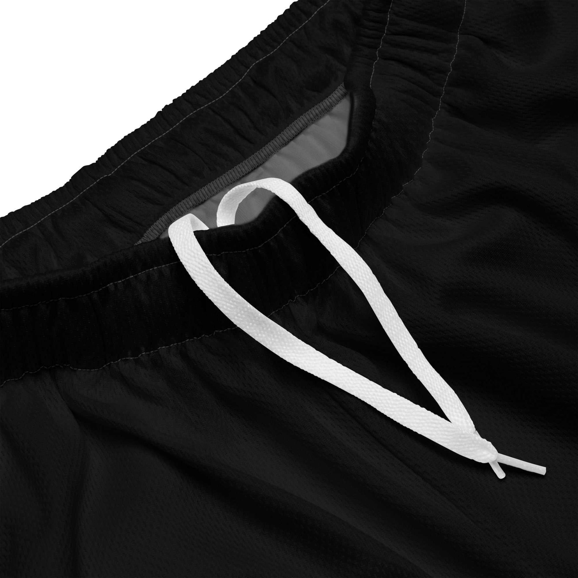 Close-up of black LegendWithin Mesh Shorts with elastic waistband and white drawstring detail