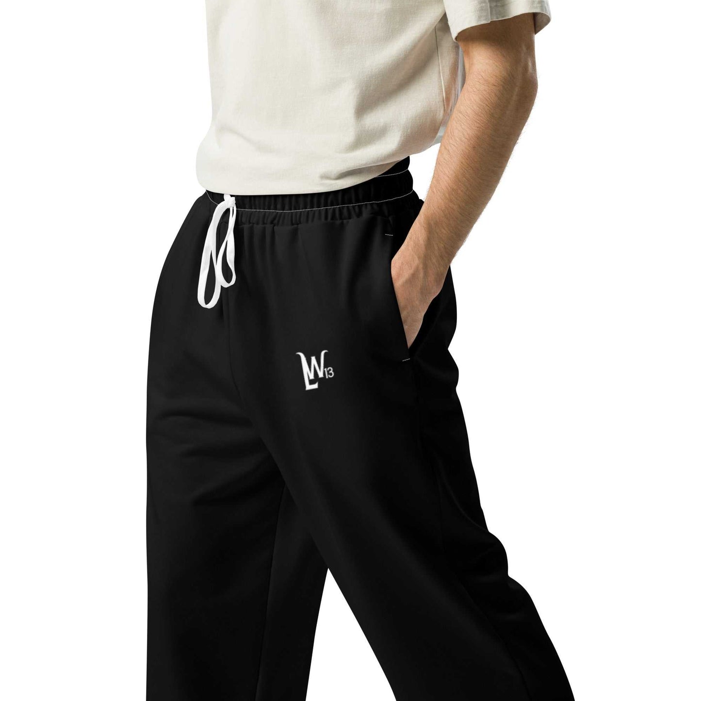 Black wide-leg joggers with white drawstring and side pockets, featuring a relaxed fit and unisex style.